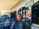 Taverna on Fourni.: Denis waiting to sample the fresh seafood on Fourni.